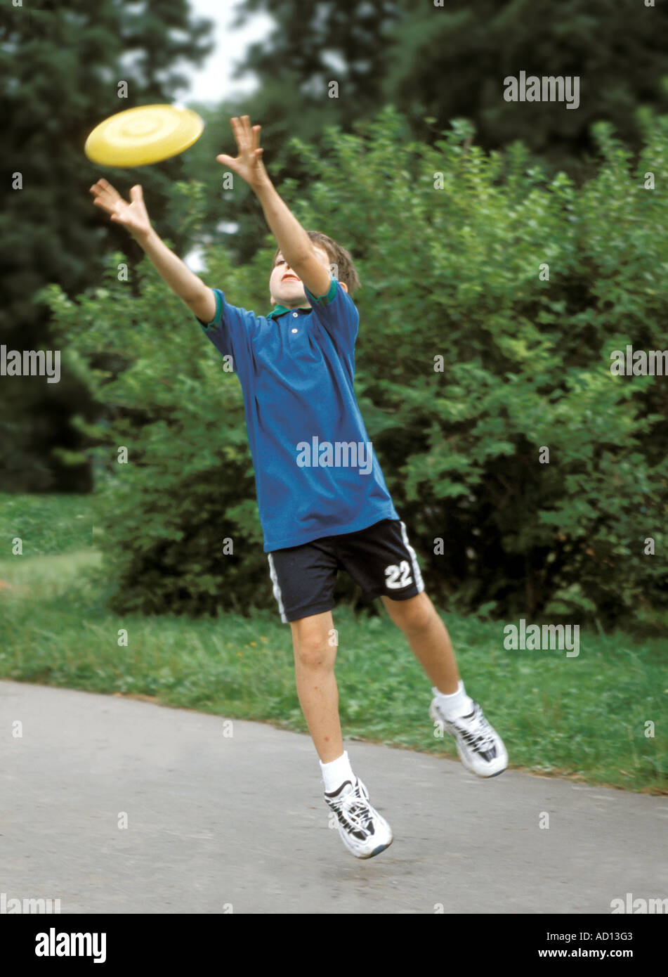 boy trying to catch a frisbee Stock Photo Alamy