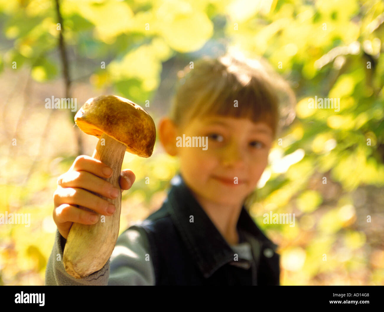 Girl showing mushroom Stock Photo - Alamy