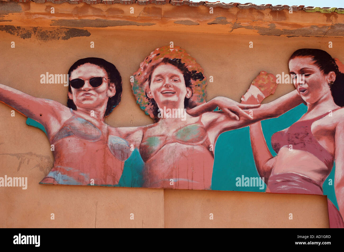 Graffiti wall painting of a young women in bikini Stock Photo - Alamy