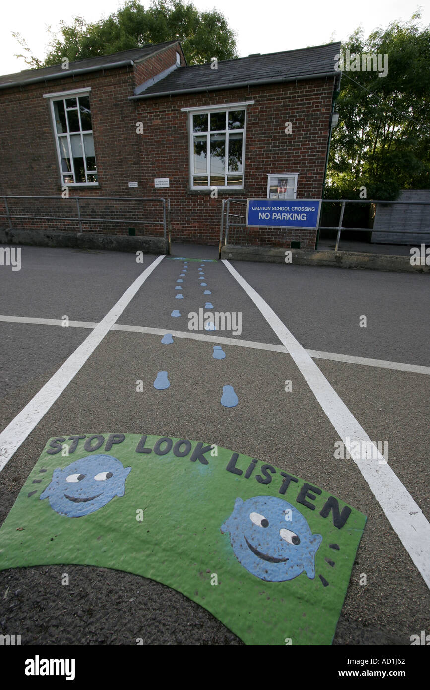 School crossing marked with instuctions Stop Look Listen Stock Photo