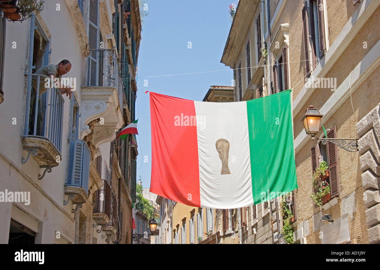 Man looks at Italian World Cup flag day after Italy win world cup final Rome Italy Stock Photo