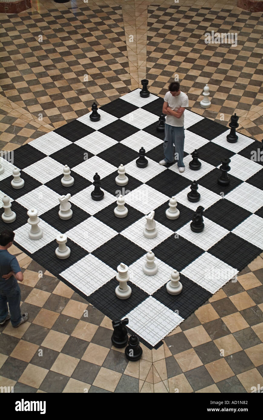 Giant chess board in the Burbank Town Center with 2 teenage Boys
