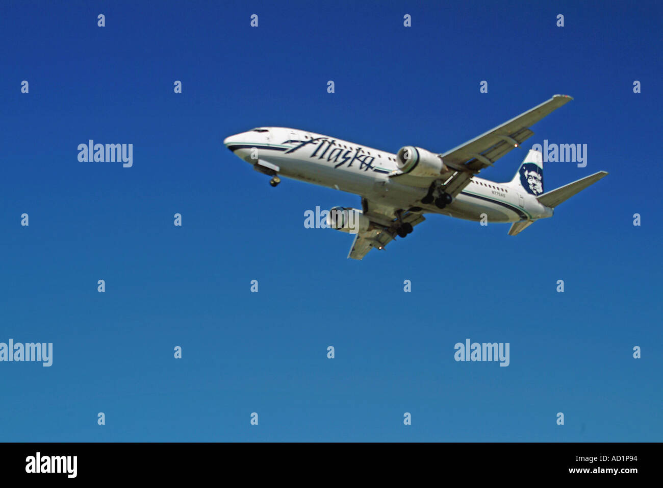 Airplane landing wheels down low altitude on approach to LAX Stock Photo Alamy