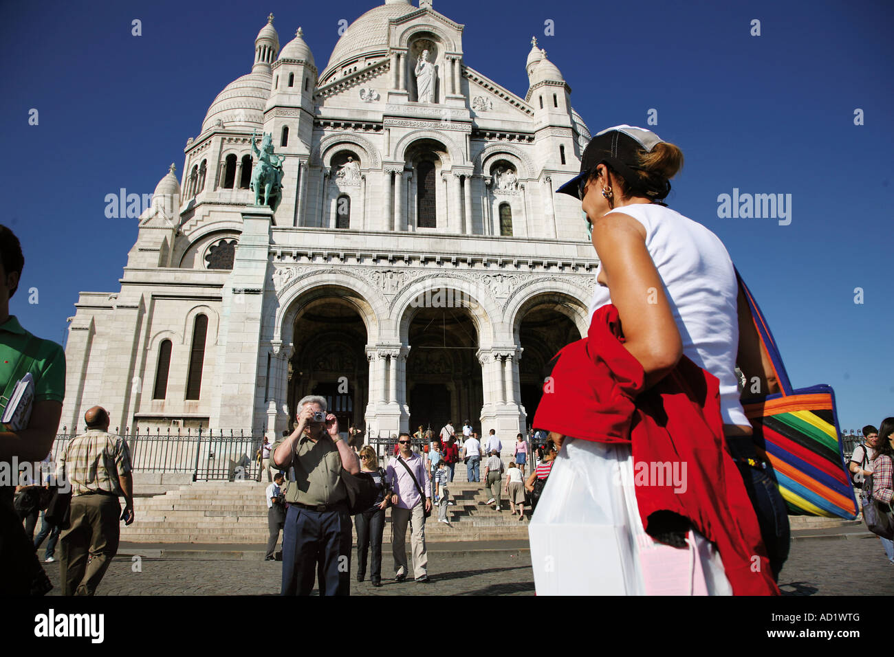 Tourist outside the Sacre Coeur in Paris Stock Photo