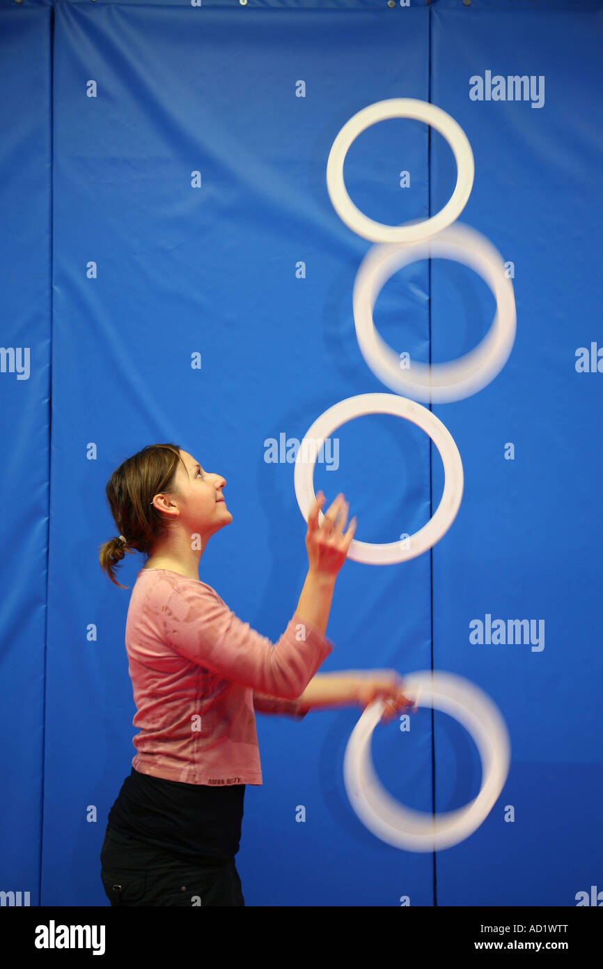 Girl juggling rings in the Hoxton circus space in London Stock Photo