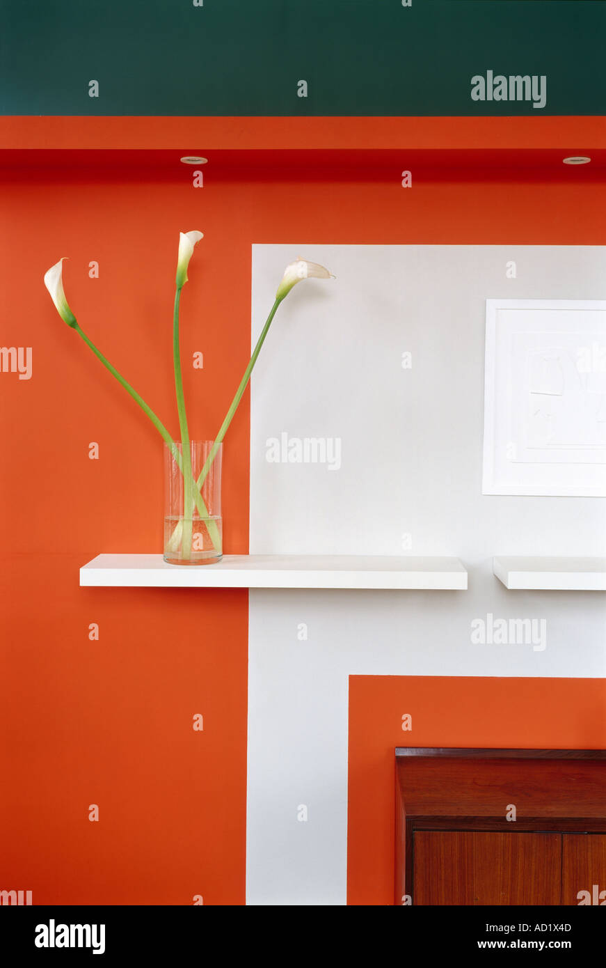 Orange wall with vase and shelves. Architect: Gareth Hoskins Architects Stock Photo
