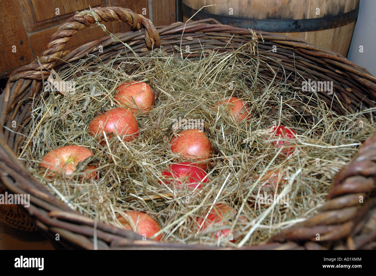 Wicker basket with apples Stock Photo - Alamy