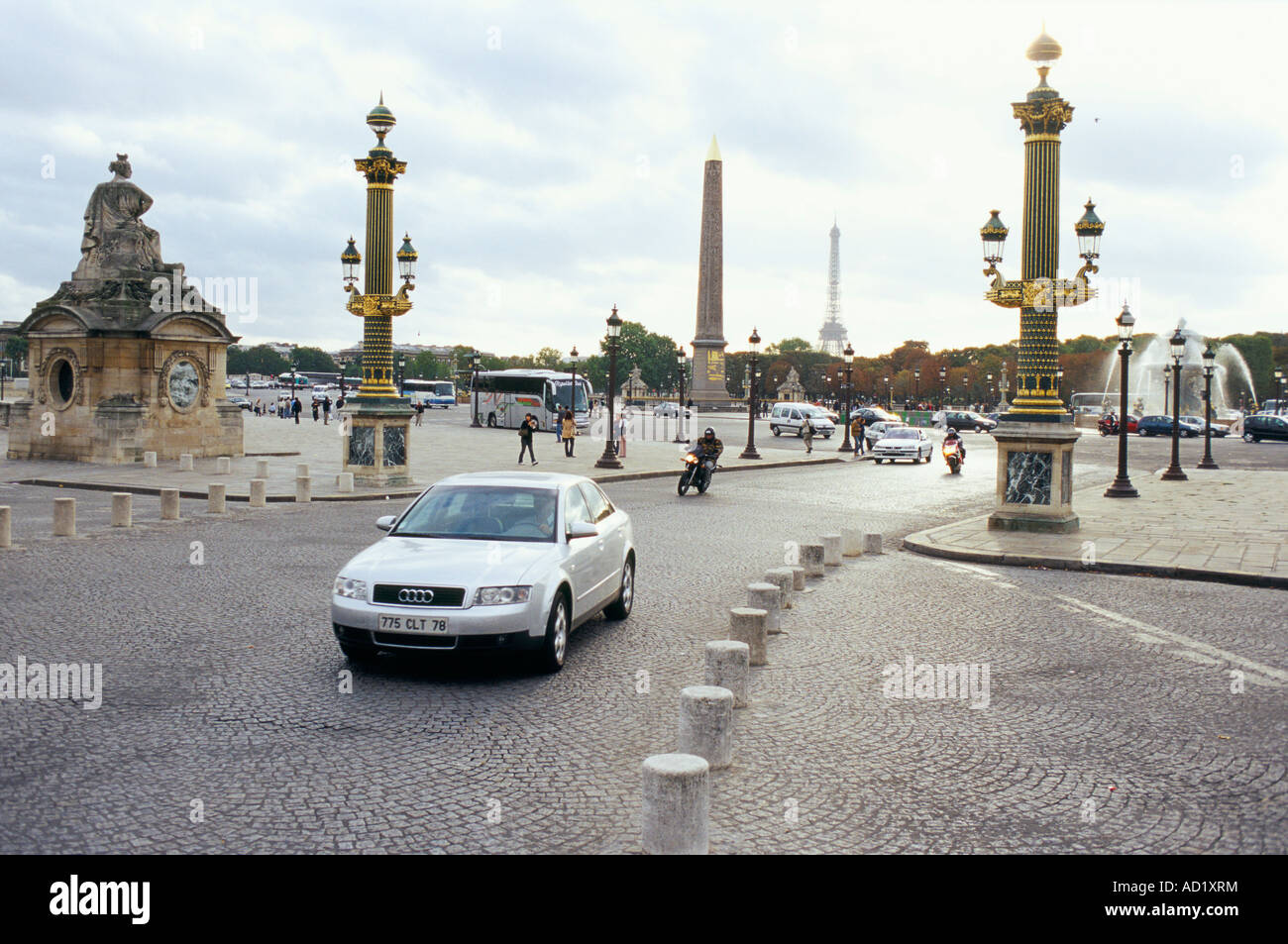 Silver Audi Car driving on the cobble stones at Place de la Concorde Paris France Stock Photo