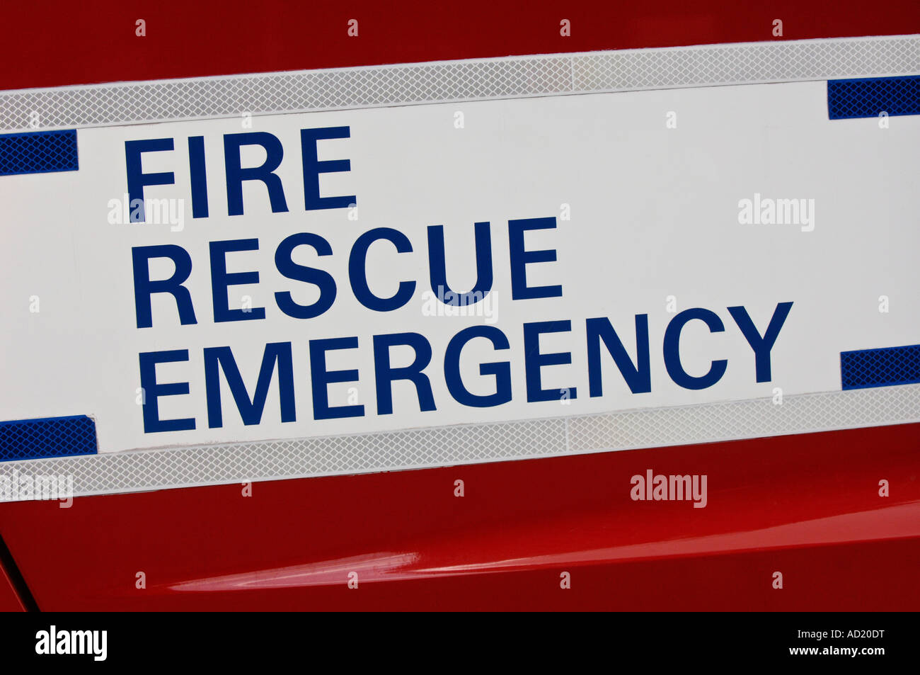 An emergency services vehicle with the word FIRE in reflective lettering on the side of the appliance. Picture by Jim Holden. Stock Photo
