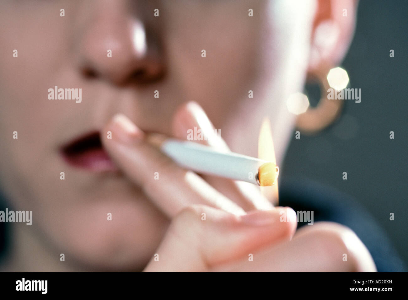 Woman Lighting Cigarette Stock Photos & Woman Lighting Cigarette Stock