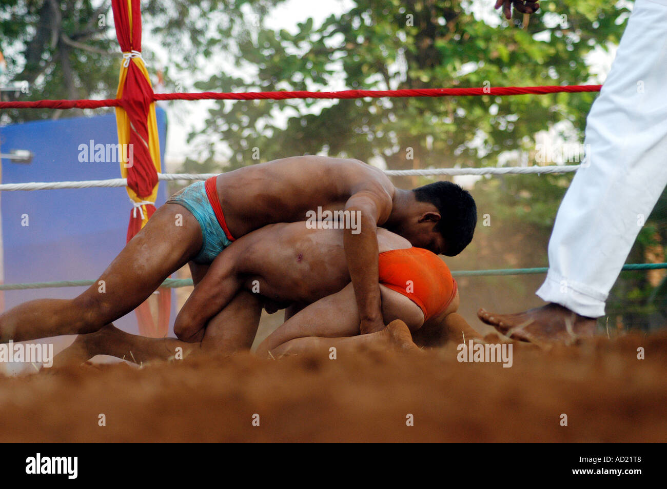 ASB73098 Two men grappling in Indian sports wrestling Stock Photo