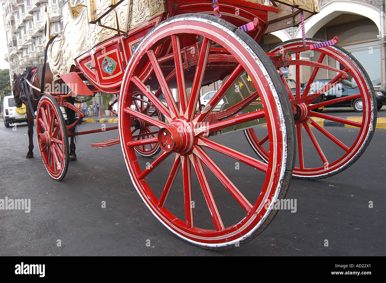 ASB72961 Red Color wheels on horse drawn carriage at Gateway of India