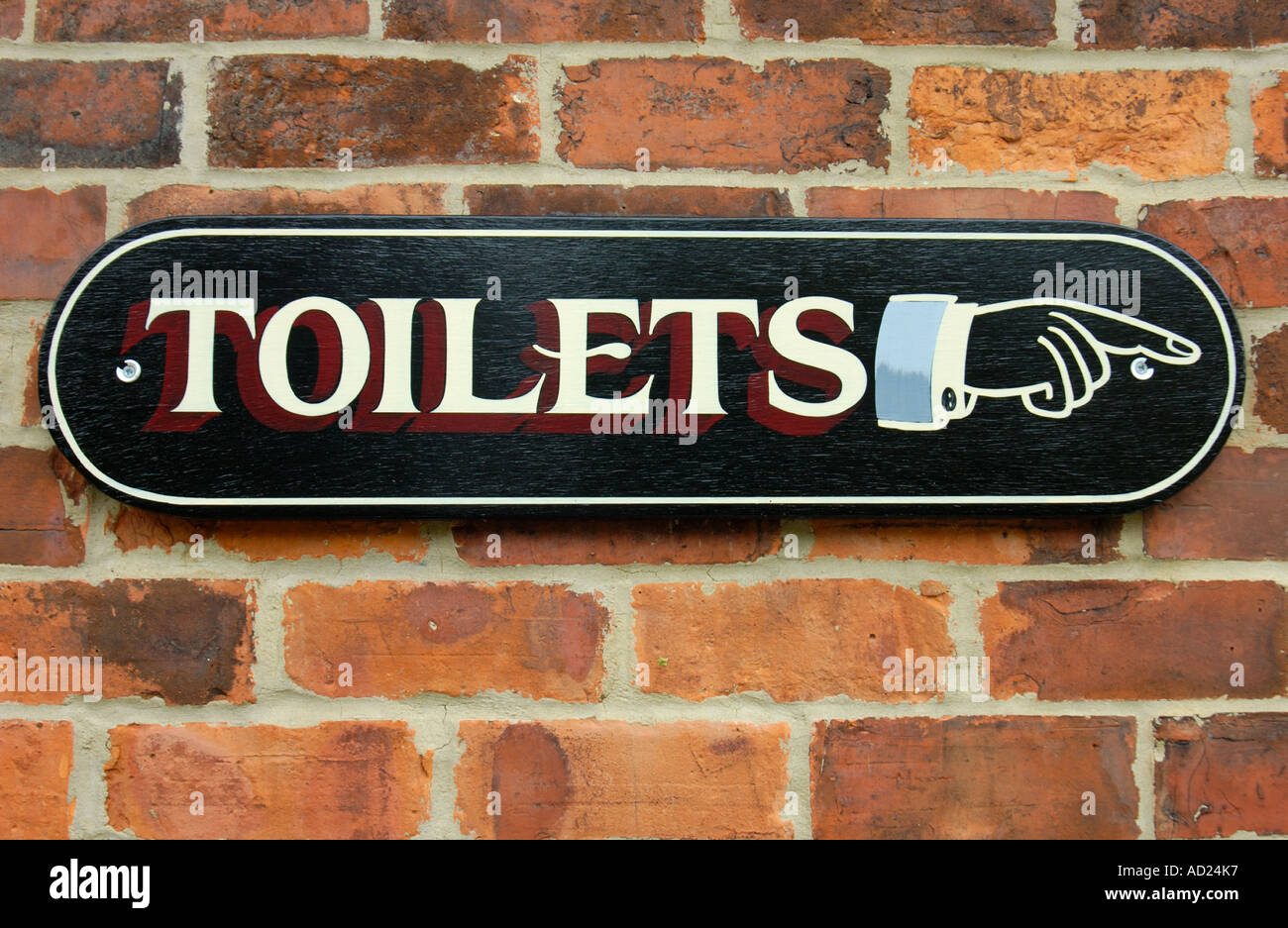 Toilets this way Stock Photo