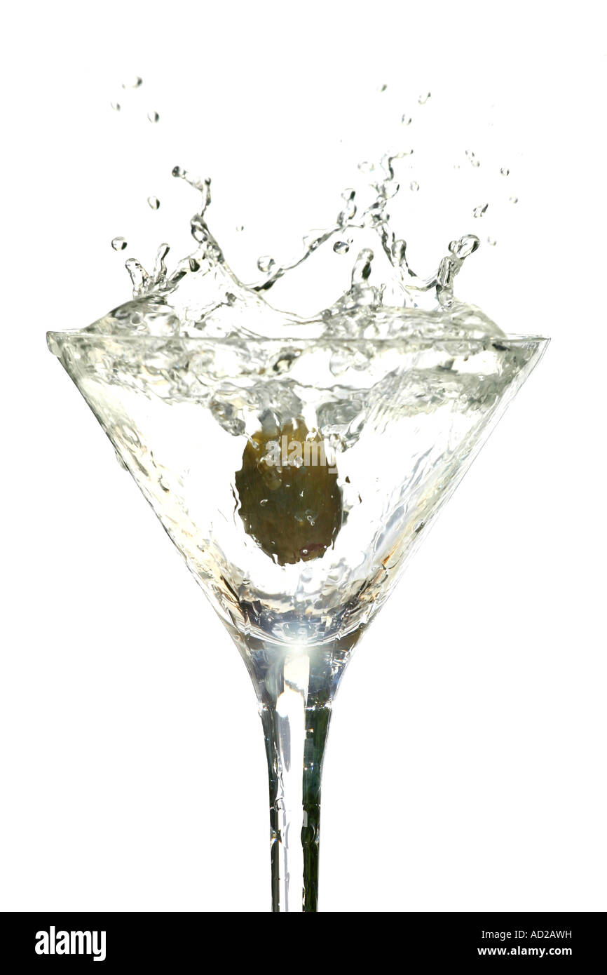 Olive splashing into Martini glass Stock Photo Alamy