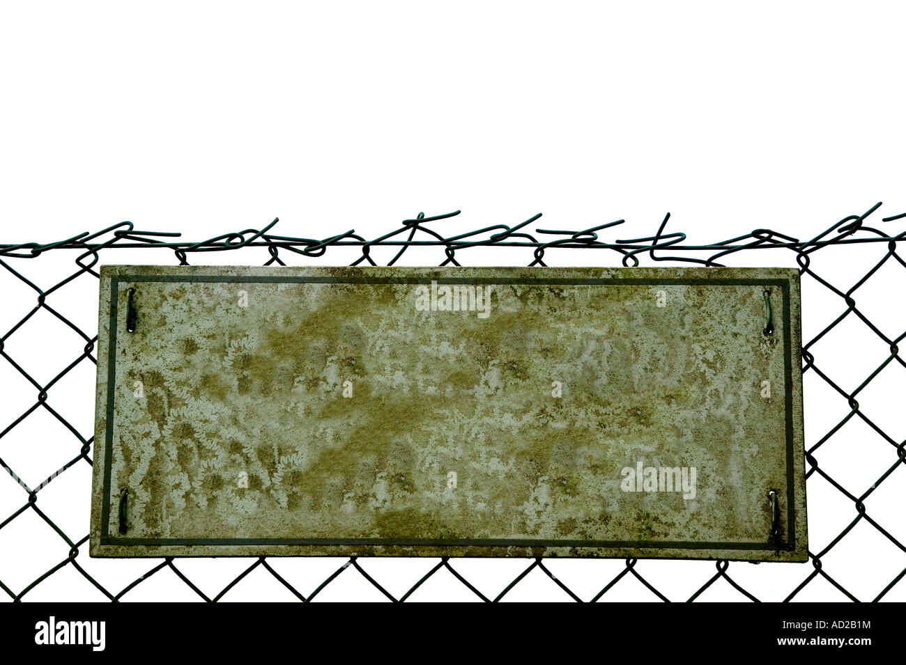Blank Grungey old sign on a chainlink fence isolated on white Stock Photo