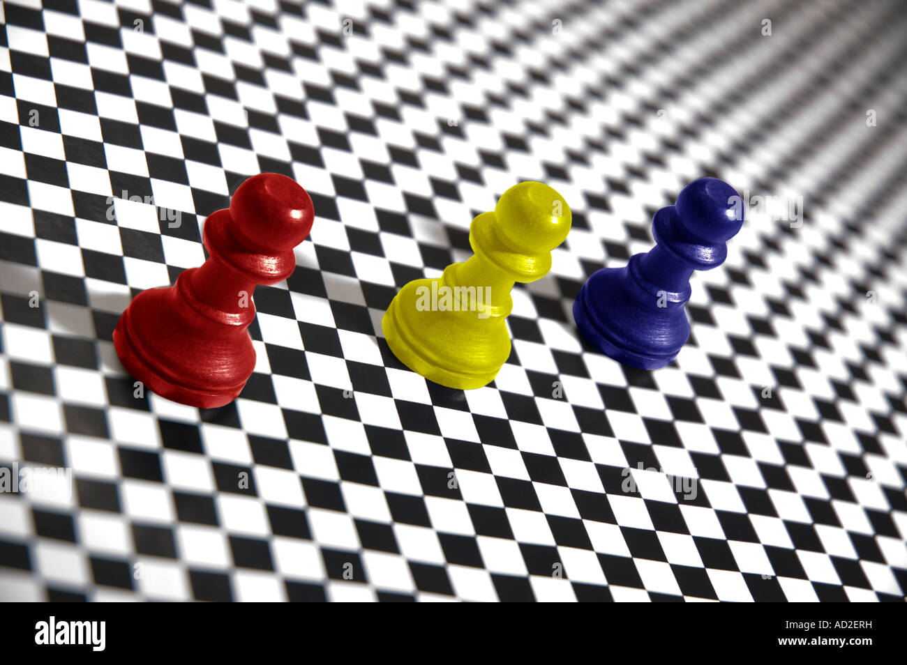 Primary coloured pawns on a checker board pattern Stock Photo - Alamy