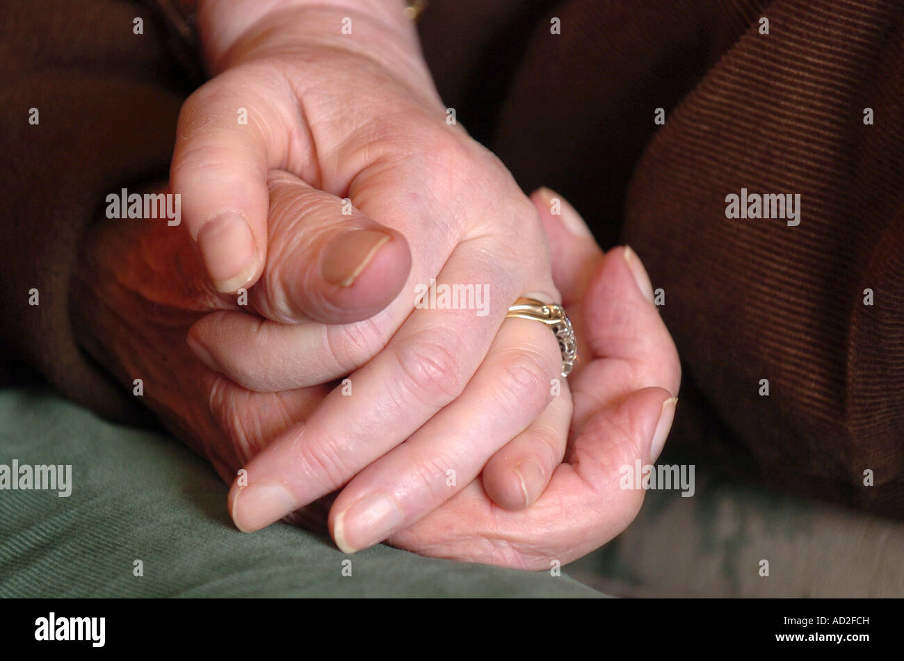 Old couple holding hands Stock Photo