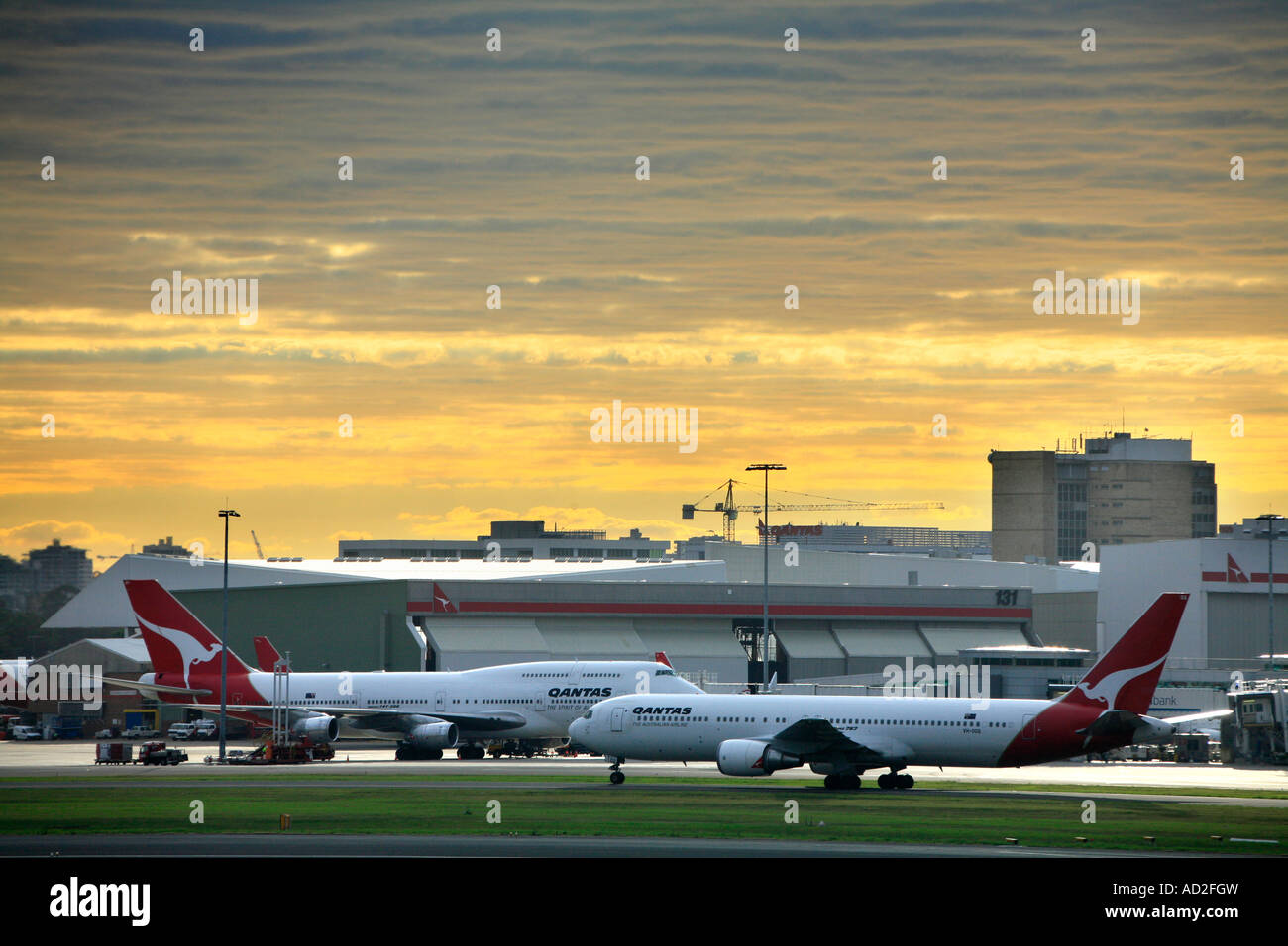 Qantas Boeing 747 Jumbo and 767 airliners at Mascot airport in the morning light Stock Photo