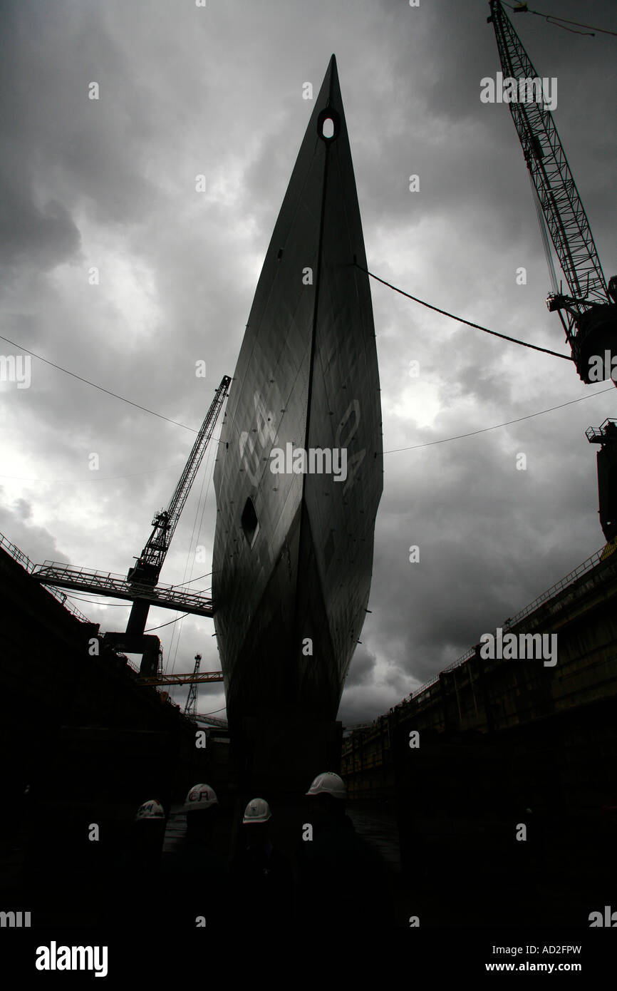 A frigate is prepared for sea after undergoing a refit at a Naval shipyard Stock Photo