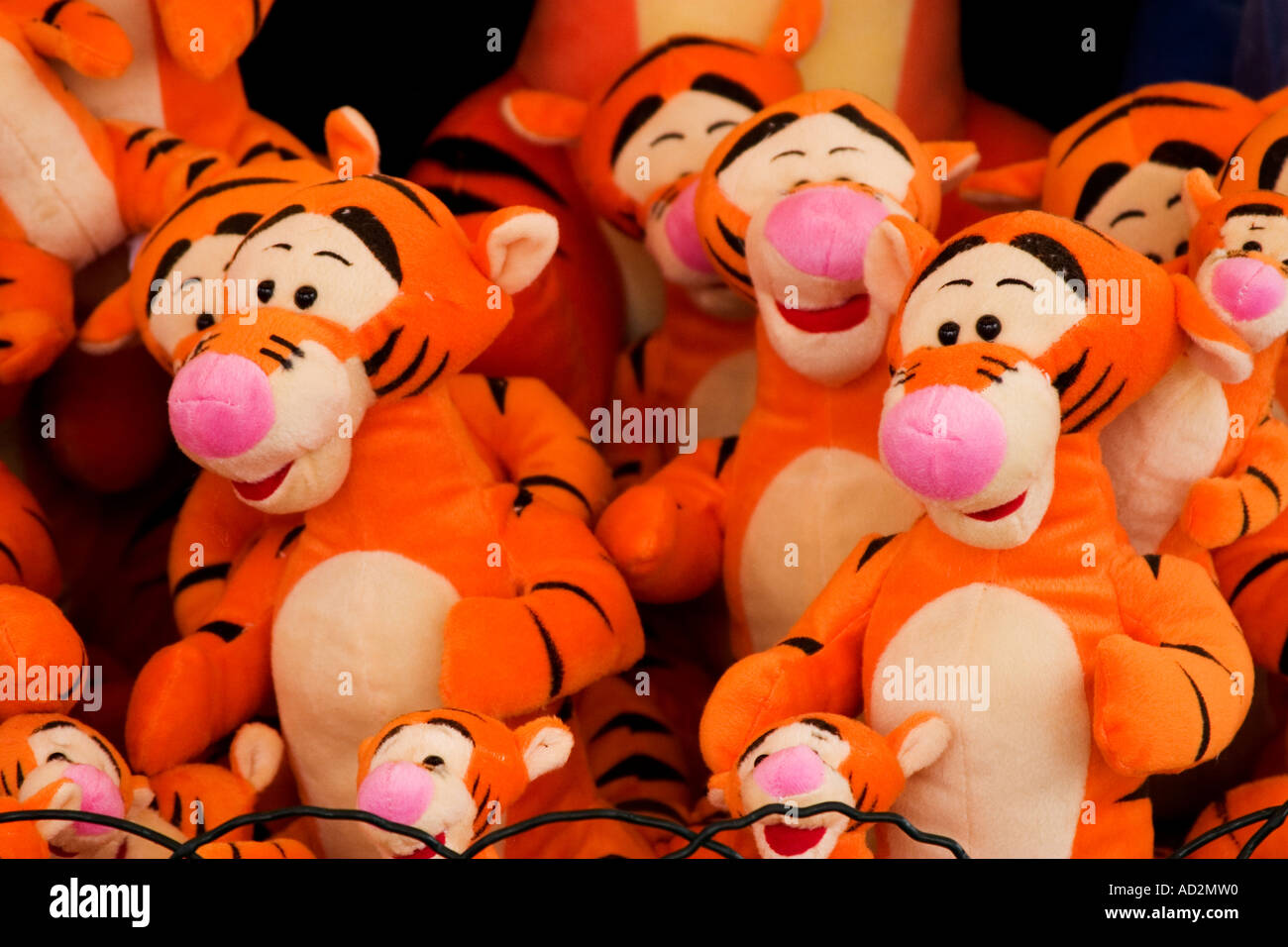 soft toy tigers piled up at a fun fair Stock Photo