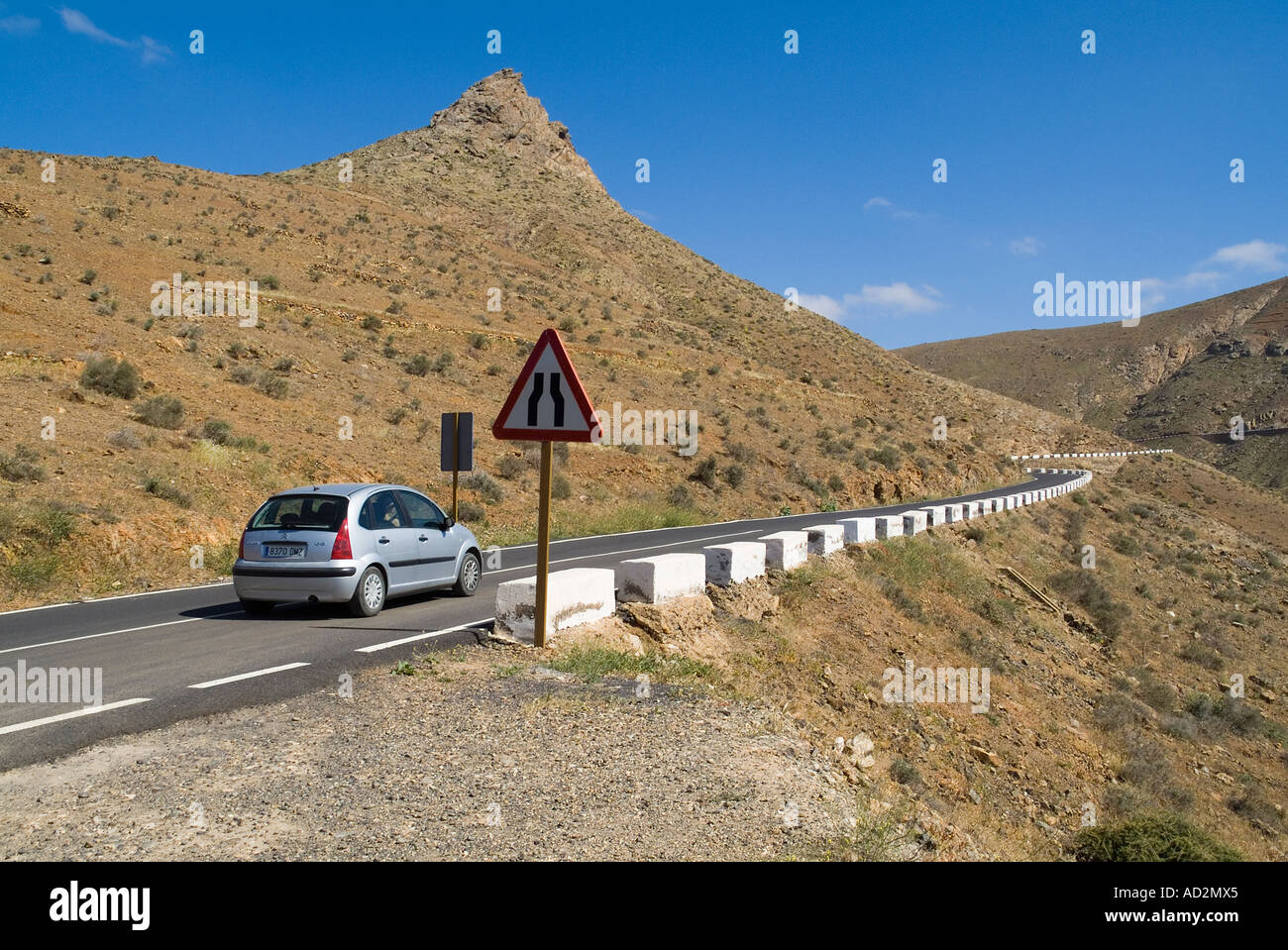dh  BETANCURIA AREA FUERTEVENTURA Tourist hired car travelling along mountaineous hillside roads sightseer road Stock Photo