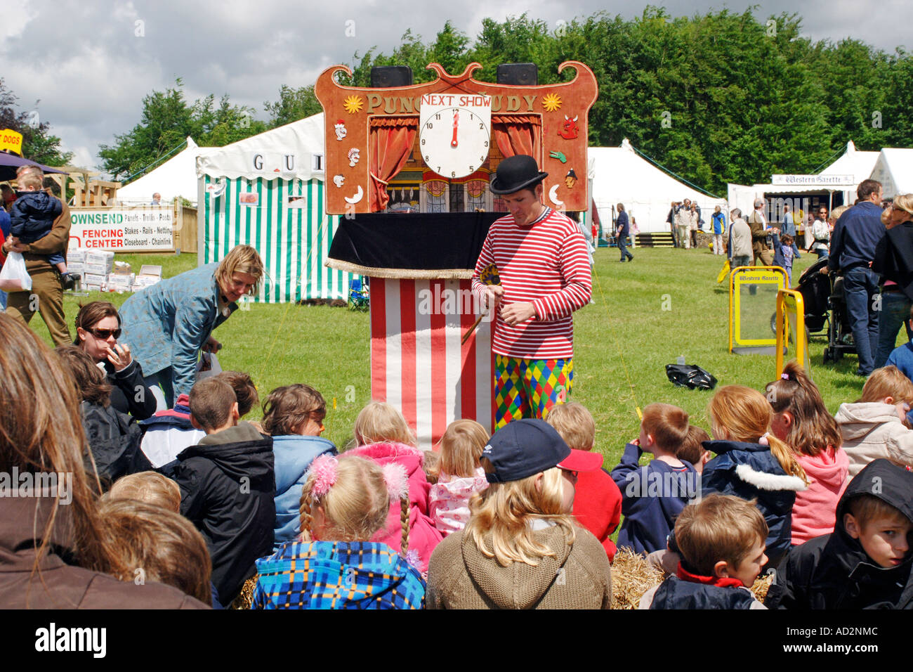 Traditional Punch and Judy show at a park festival Stock Photo