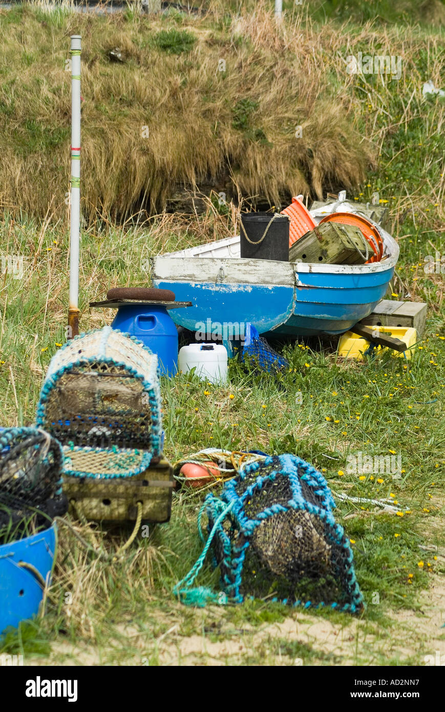 dh  GLIMS HOLM ORKNEY Fishing boat beached with lobster and crab creels Stock Photo