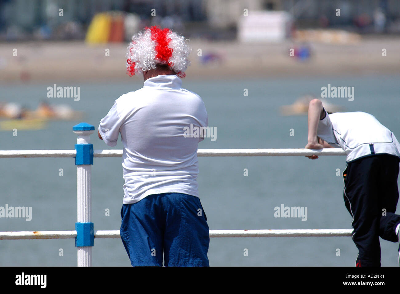 England Football supporter on vacation wearing a red and white wig. Stock Photo
