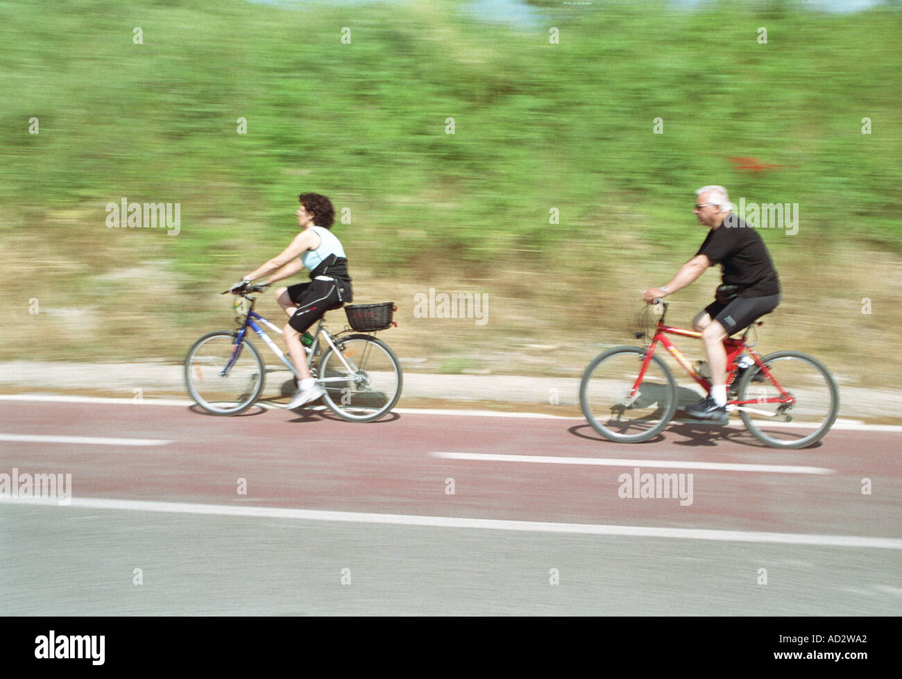 Two cyclists passing road hi-res stock photography and images - Alamy