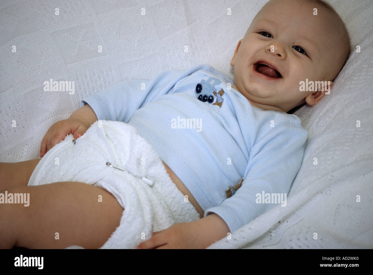Happy Baby In Terry Nappies Stock Photo