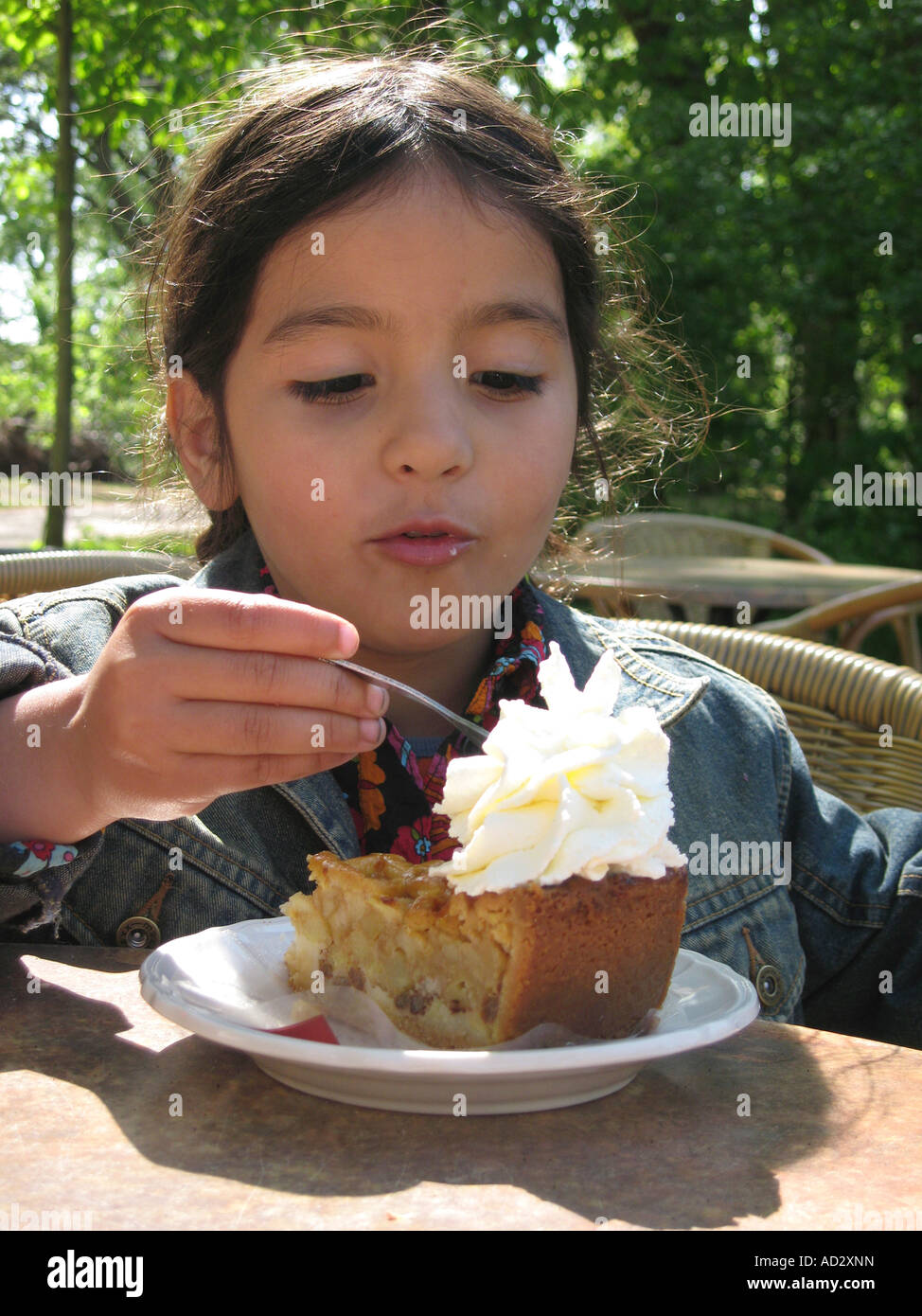 Little girl eating apple pie Stock Photo