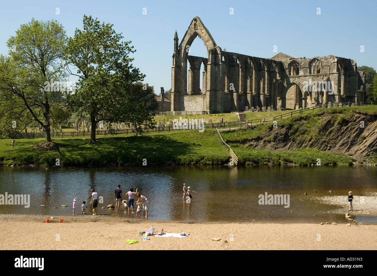 Family paddling in the River Wharfe at Bolton Abbey Stock Photo