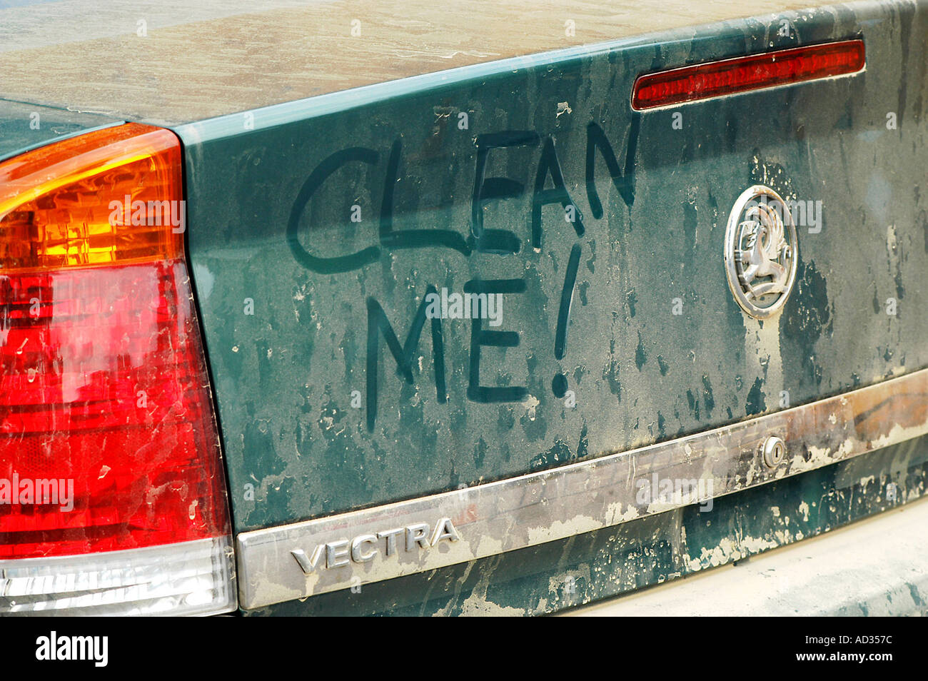 Graffiti on dirty Vauxhall Vectra 2003 Stock Photo