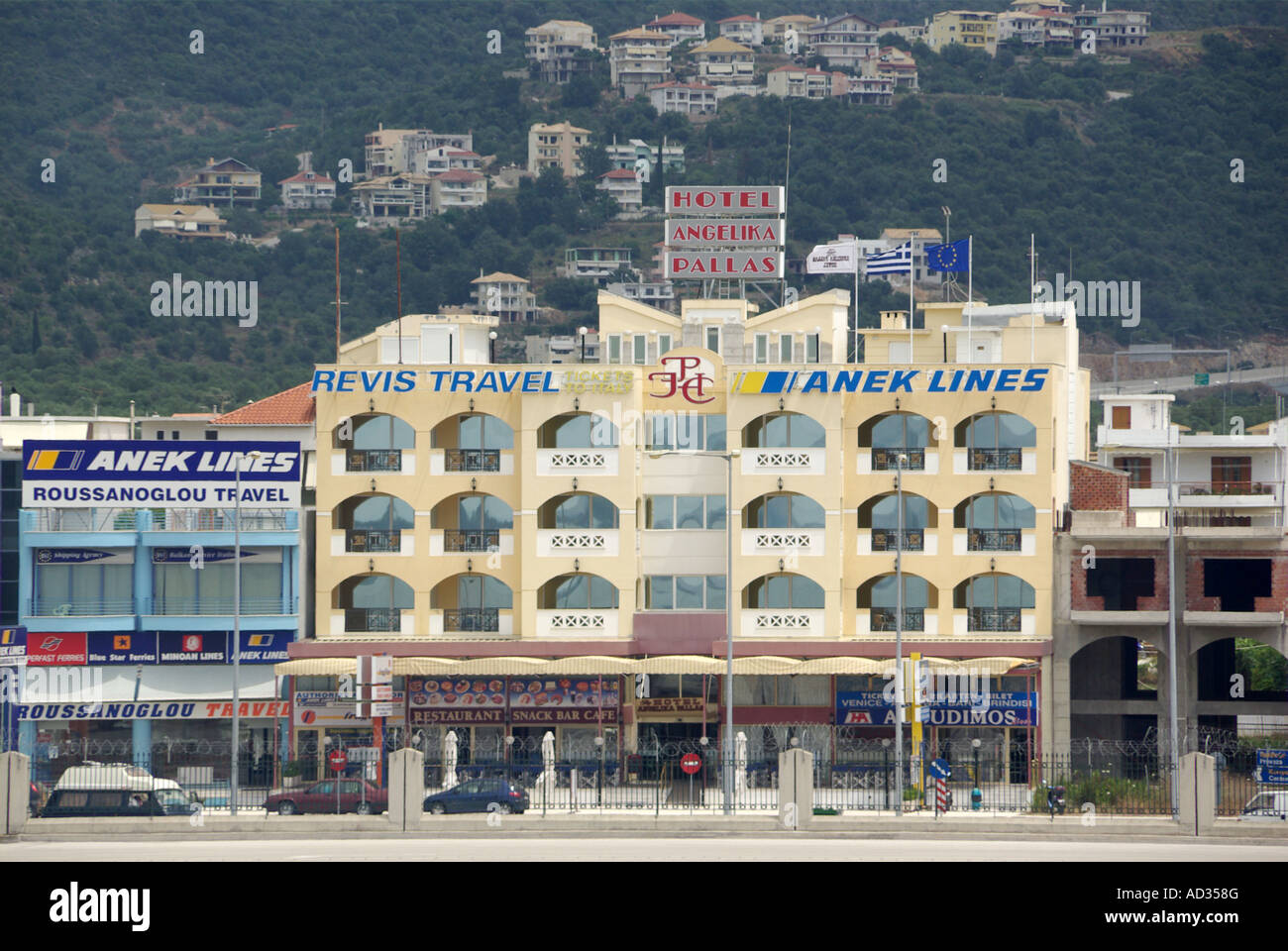 Igoumenitsa dockside access road hillside homes beyond Stock Photo Alamy