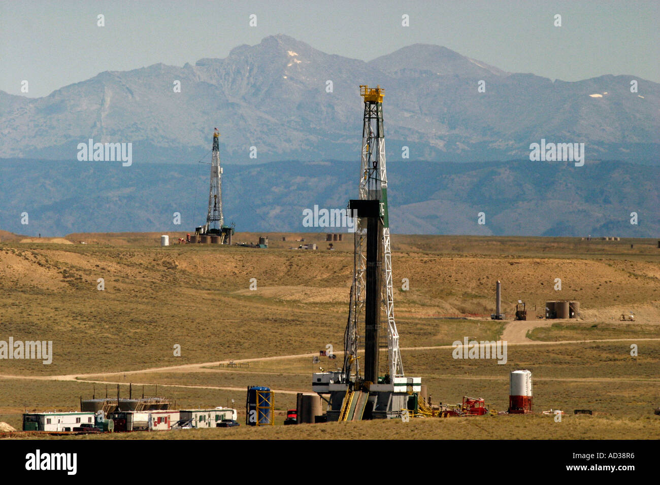 Drilling rigs drill for oil and natural gas in the Jonah Field near
