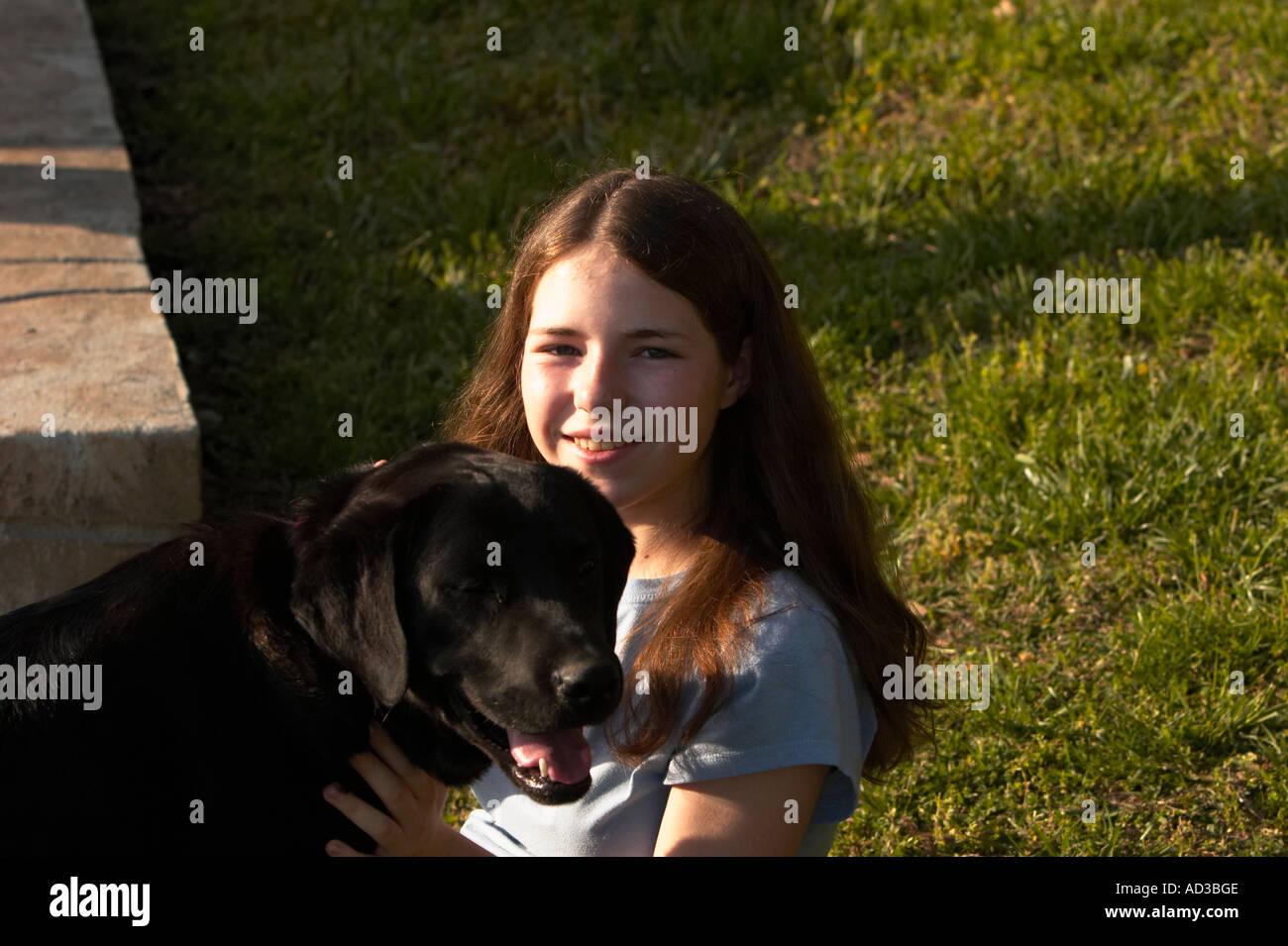 A young teenage girl with a dog Stock Photo - Alamy