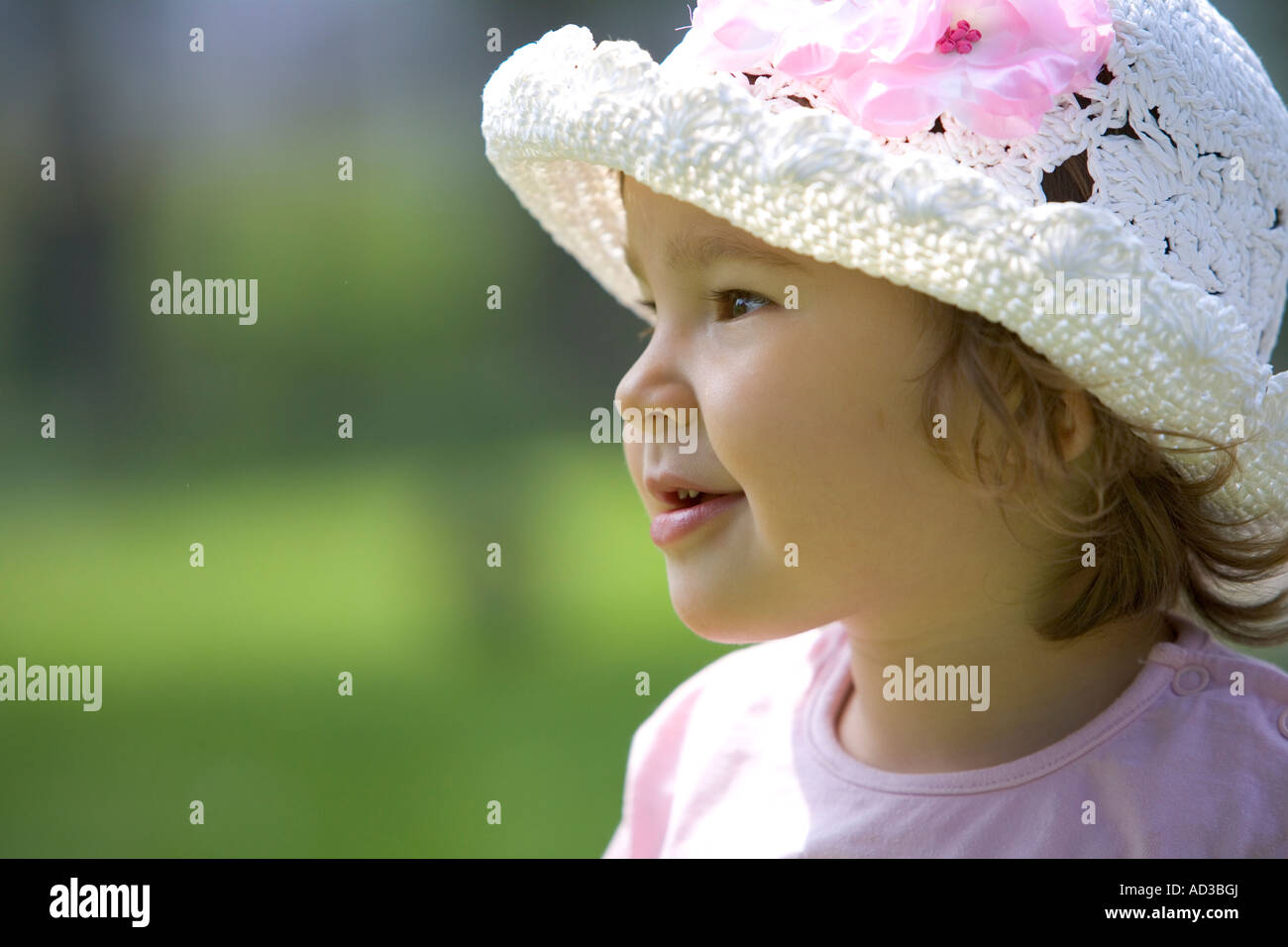 Portrait of little girl with a hat Stock Photo - Alamy