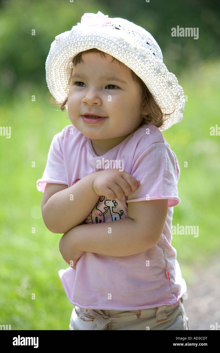 Portrait of little girl with a hat Stock Photo - Alamy