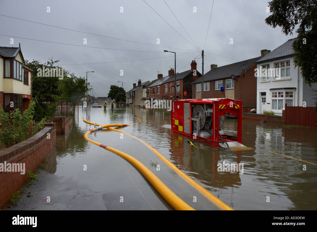 FLOOD WATER IN THE STREETS OF BENTLEY VILLAGE YORKSHIRE ENGLAND JUNE