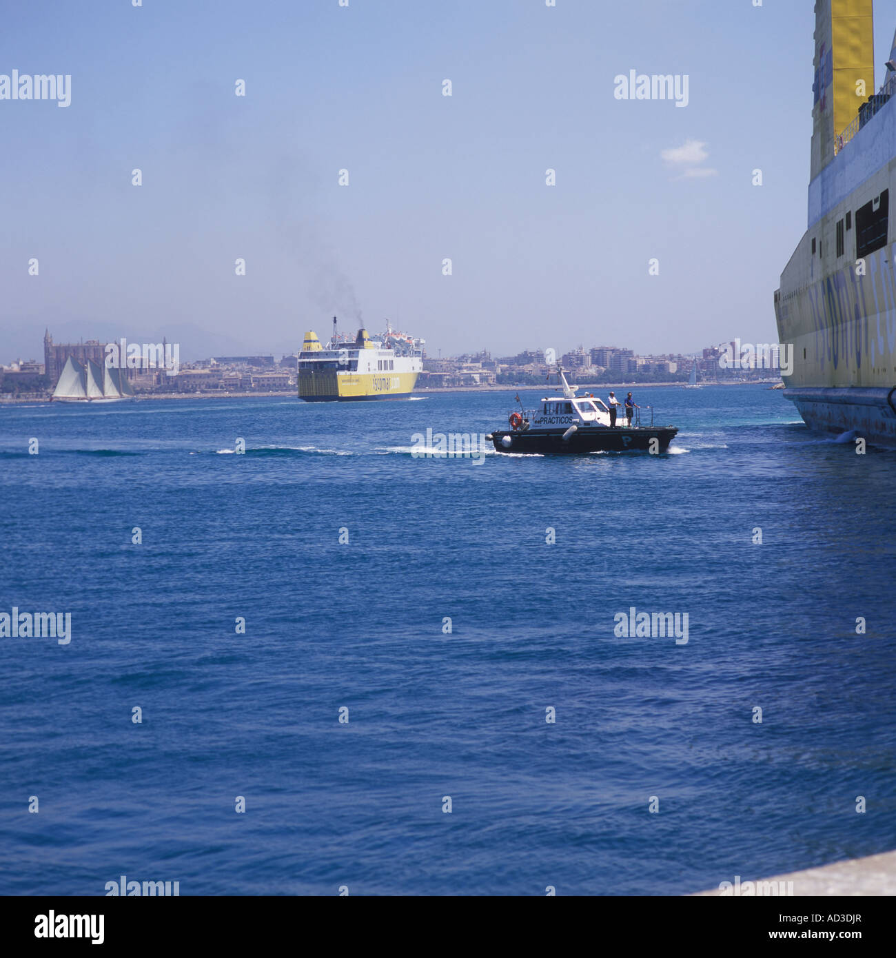 Pilot Launch (Lancha de practicos ) with port pilot on board approaching ISCOMAR passenger / cargo ferry Palma Mallorca Stock Photo
