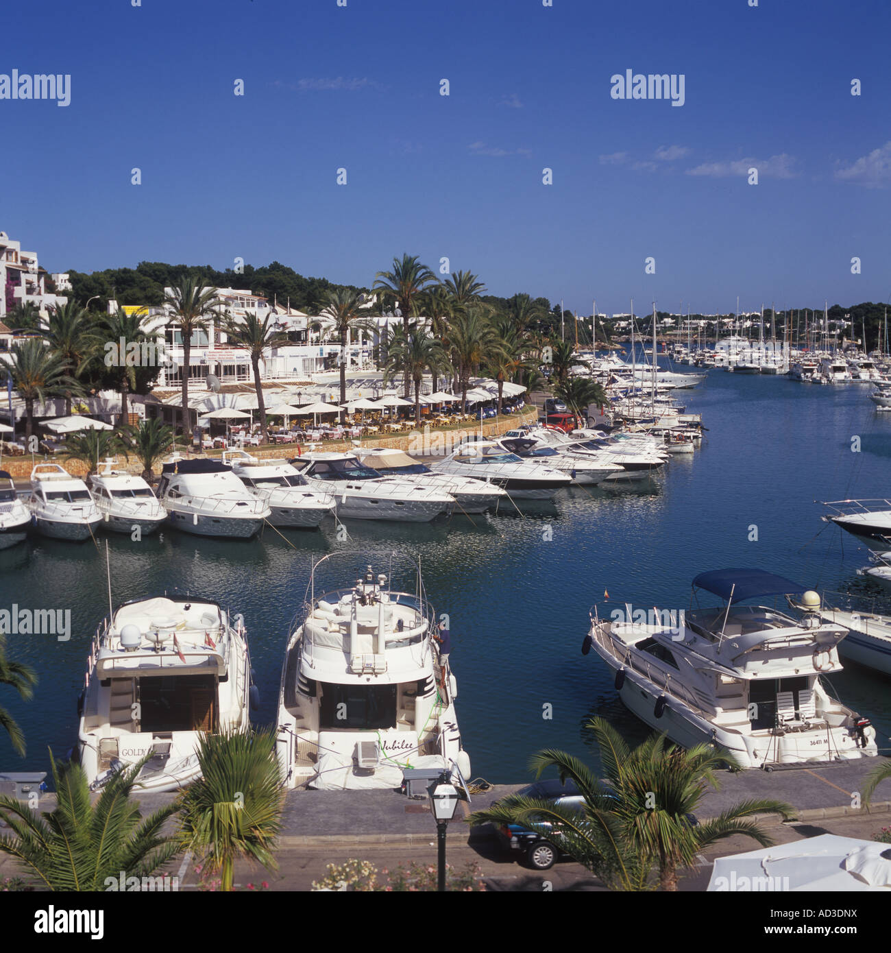 Looking East over restaurant area and moored sailing and motor yachts , Cala D'Or Marina, Cala D'Or, Santanyi, Mallorca. Stock Photo