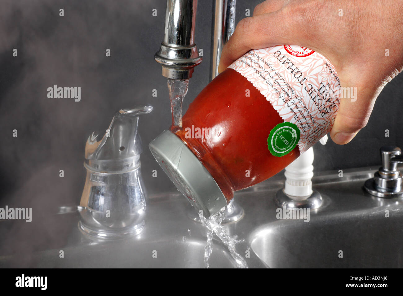 Hot Water Expands Metal Cap for Easy Removal Stock Photo Alamy