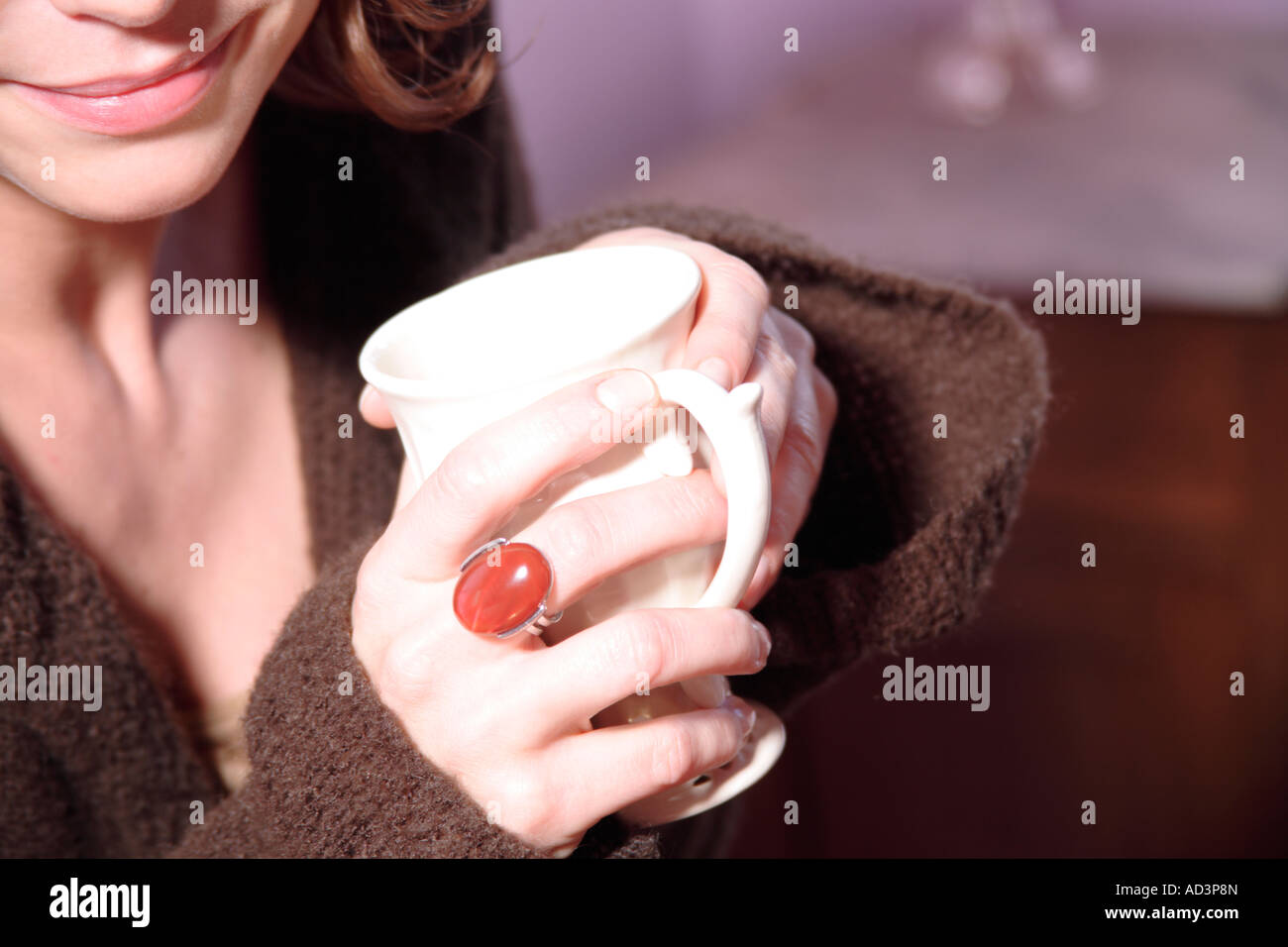 Young woman holding cup of tea, close up Stock Photo