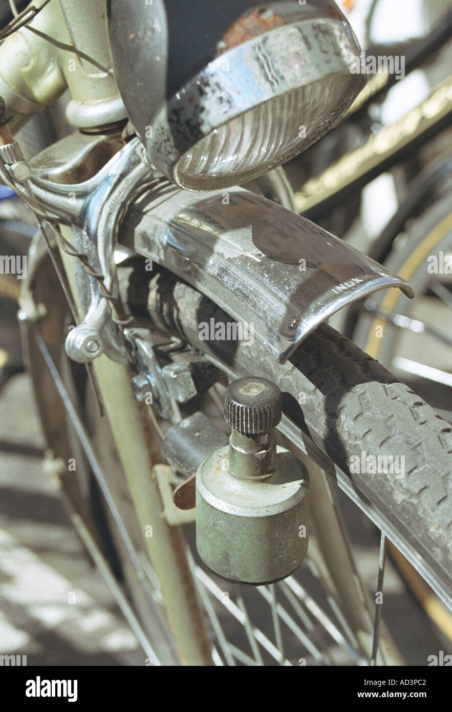 detail of dynamo on bike wheel Stock Photo Alamy