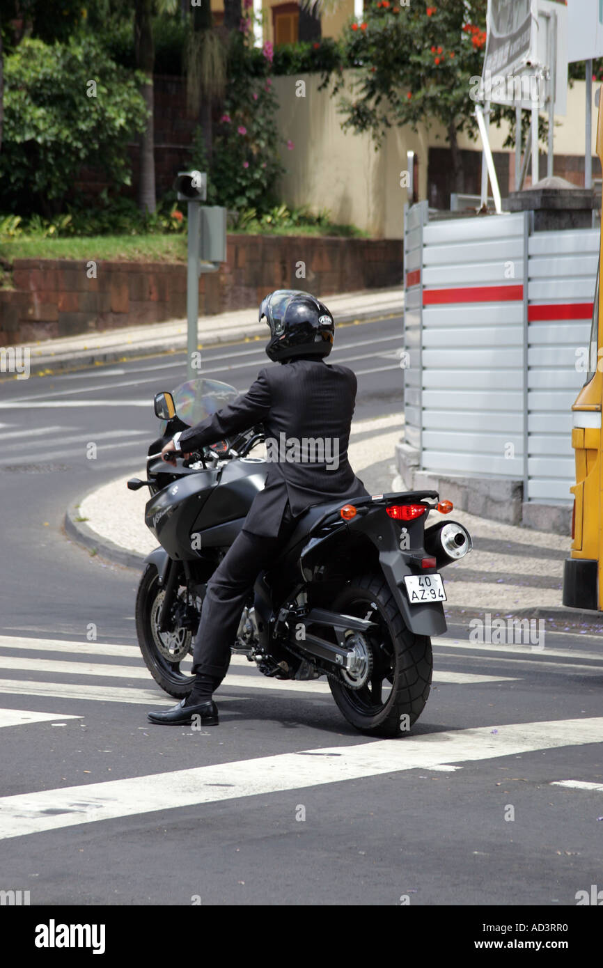 Motorcyclist in a suit Stock Photo - Alamy