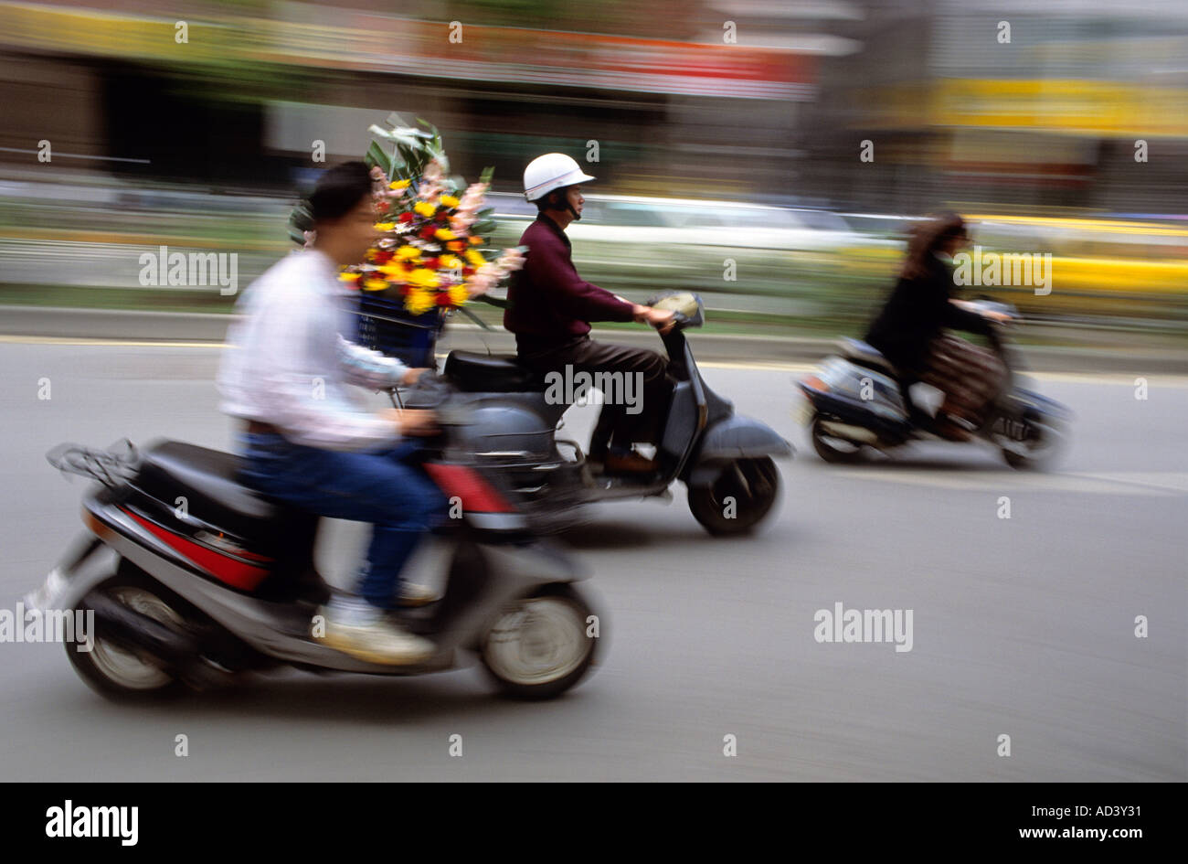 People riding scooters in Taipei Taiwan Flower delivery man uses scooter Stock Photo Alamy