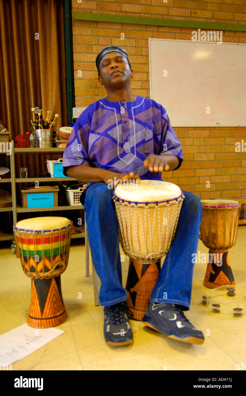 African men playing drums hi-res stock photography and images - Alamy