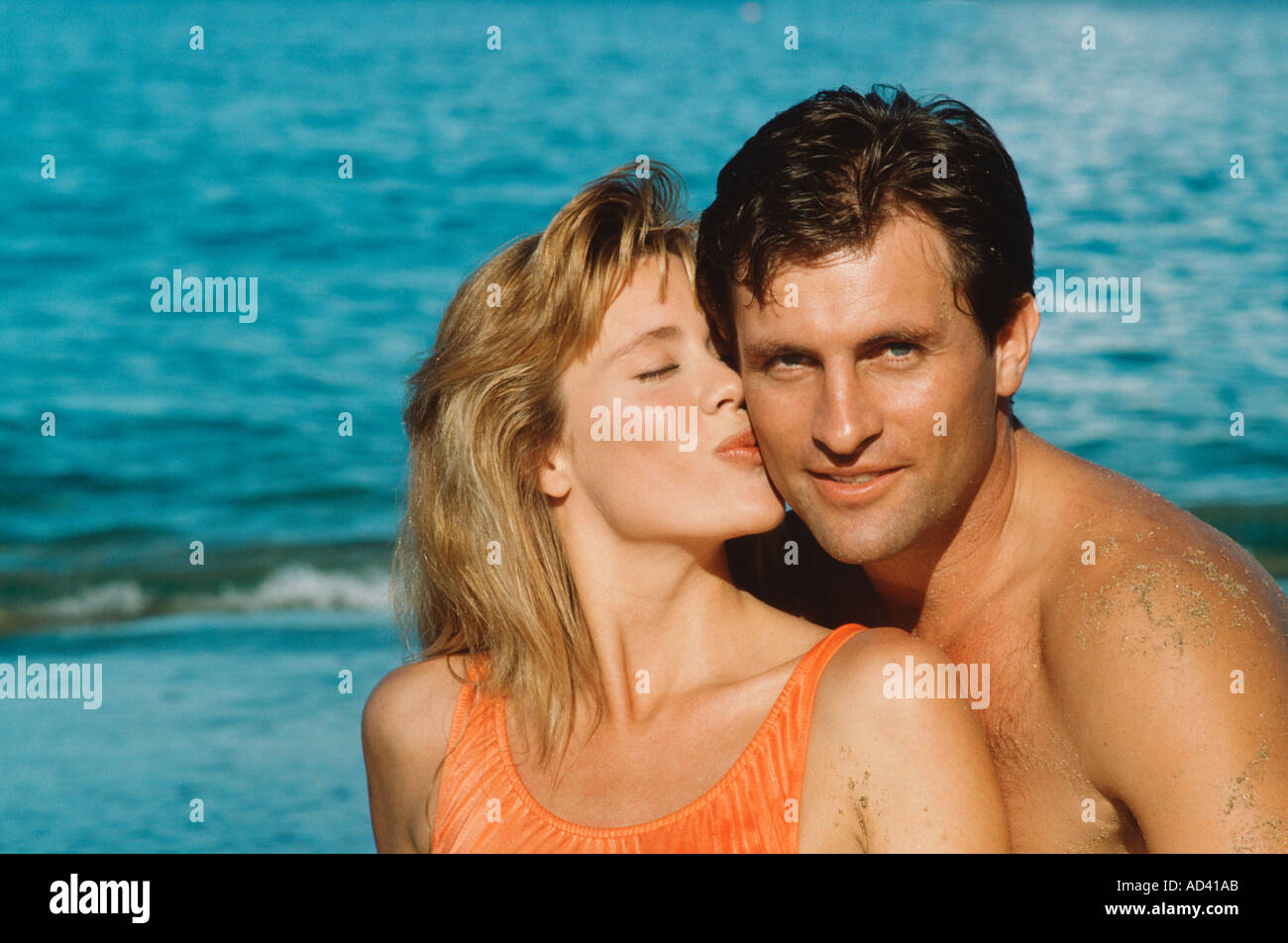 Portrait of couple kissing on beach Stock Photo