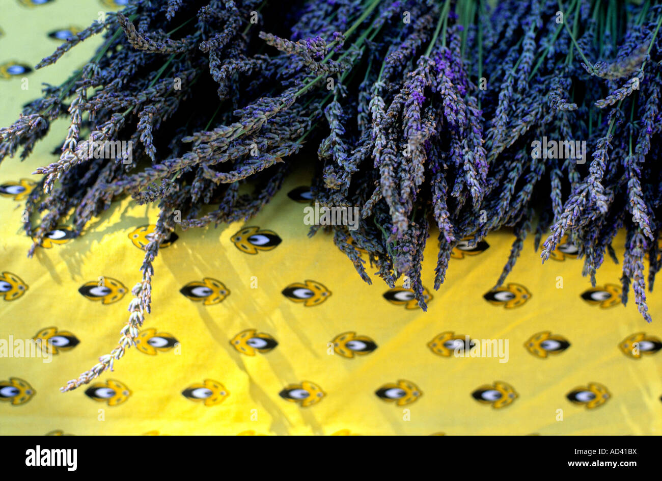 Lavender on a pretty tablecloth for sale in a market in Provence, France Stock Photo