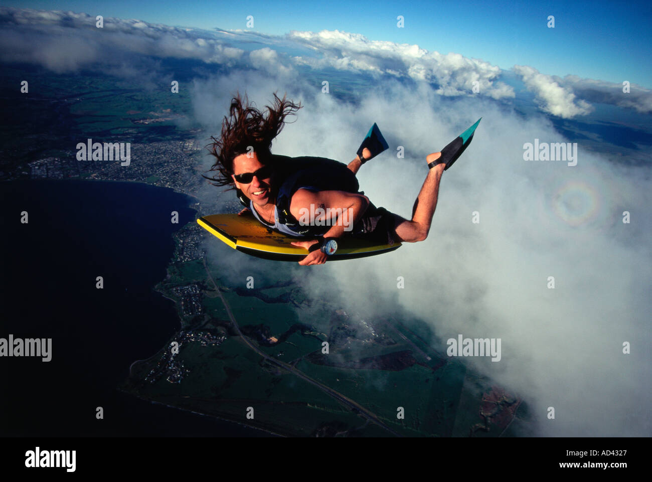 Sky surfing boogie board at 7000 ft Location New Zealand over Lake